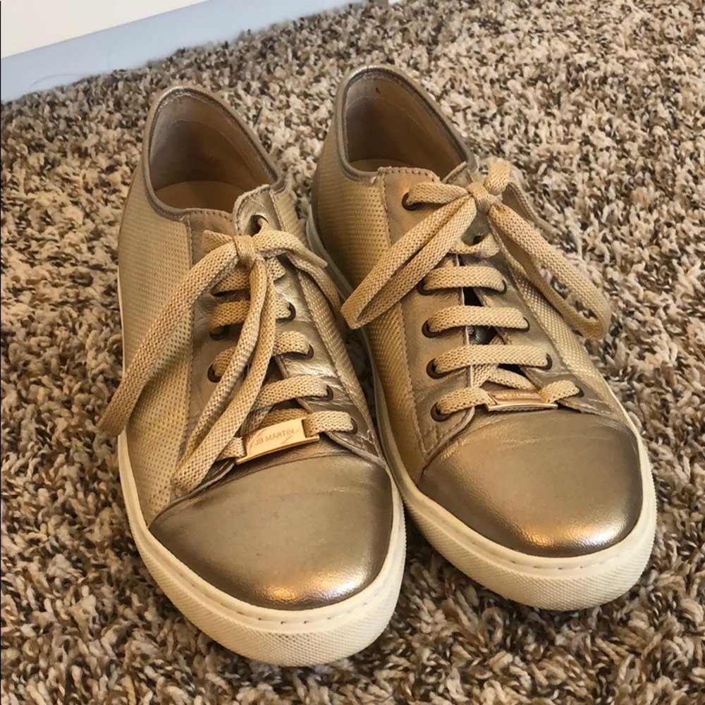 Gold tennis shoes